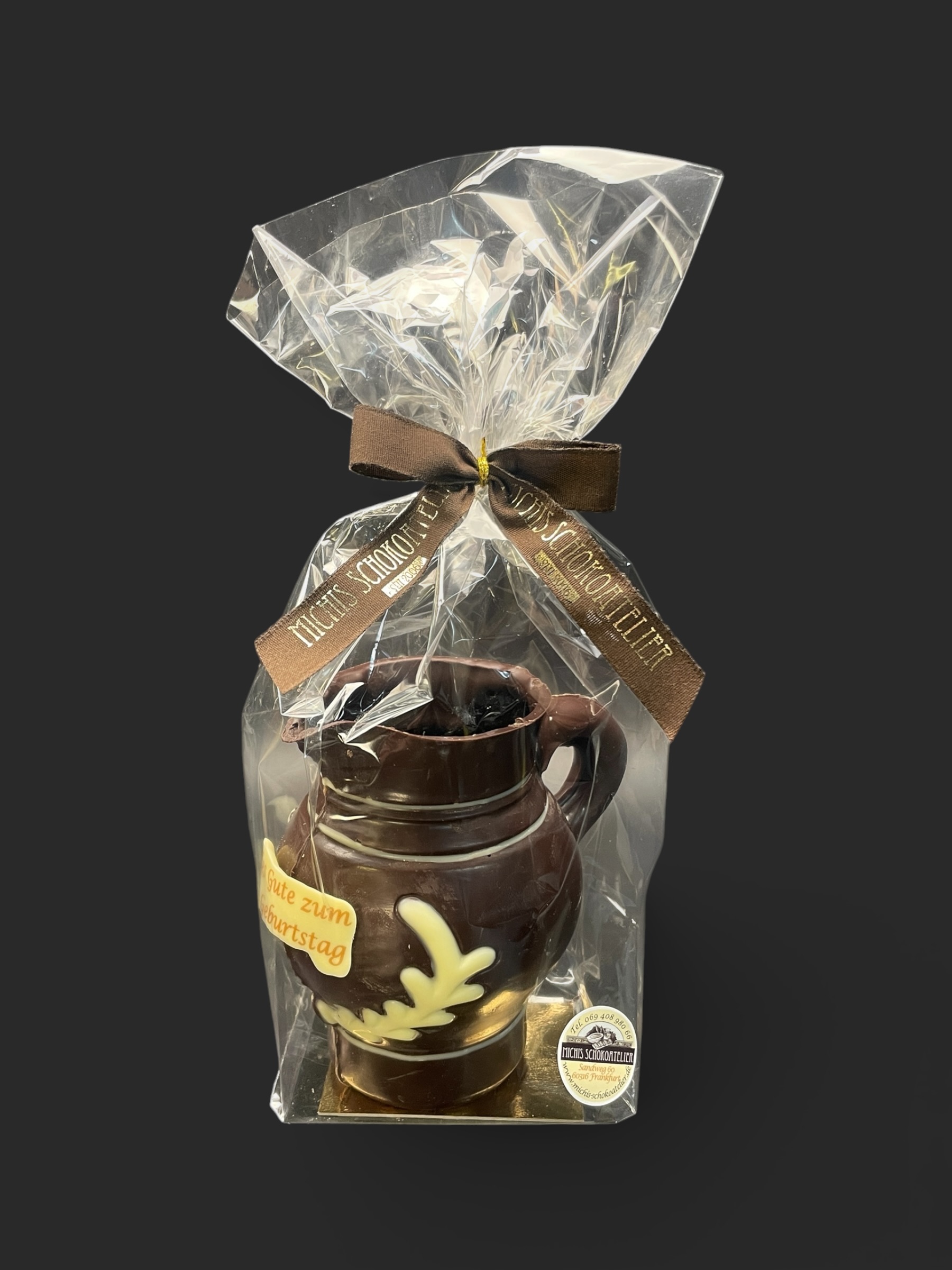 Bembel-Figur aus Zartbitterschokolade (65 % Kakao), mit Aufschrift „Alles Gute zum 70 Geburtstag“, Seitenansicht, in Geschenkverpackung