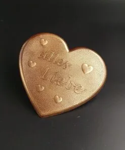 Dark chocolate heart with "all my love" lettering and bronze-colored food coloring