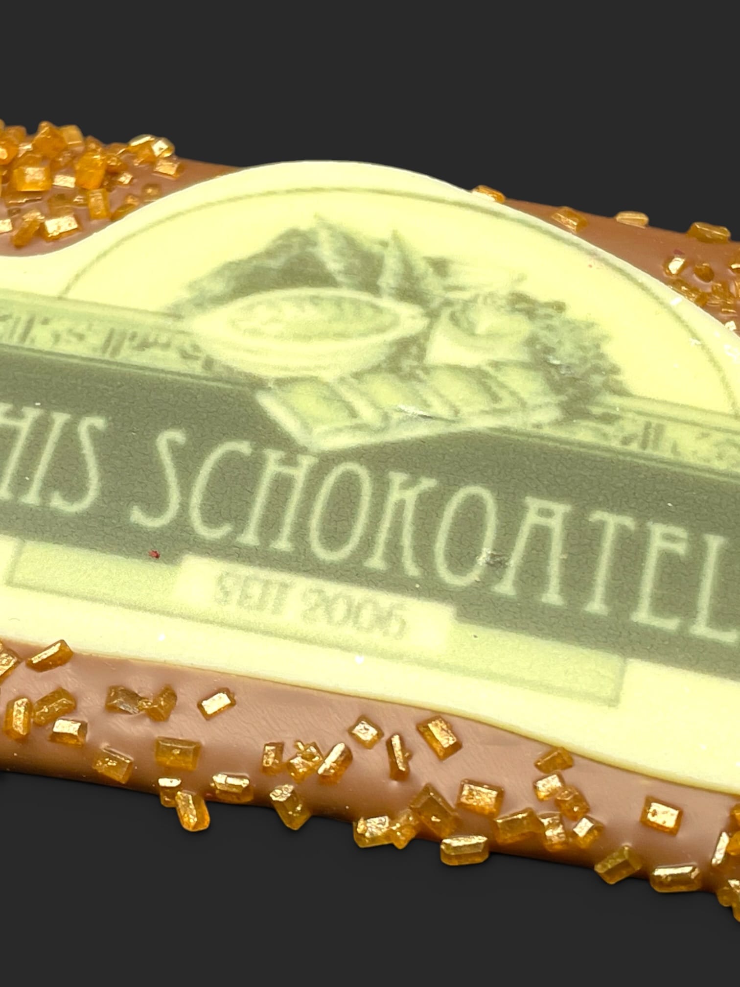 Mini-Schokoladentafel aus Vollmilchschokolade (40 % Kakao), mit Aufschrift „Minitafel Zuckerstreusel LOGO“, Detailansicht